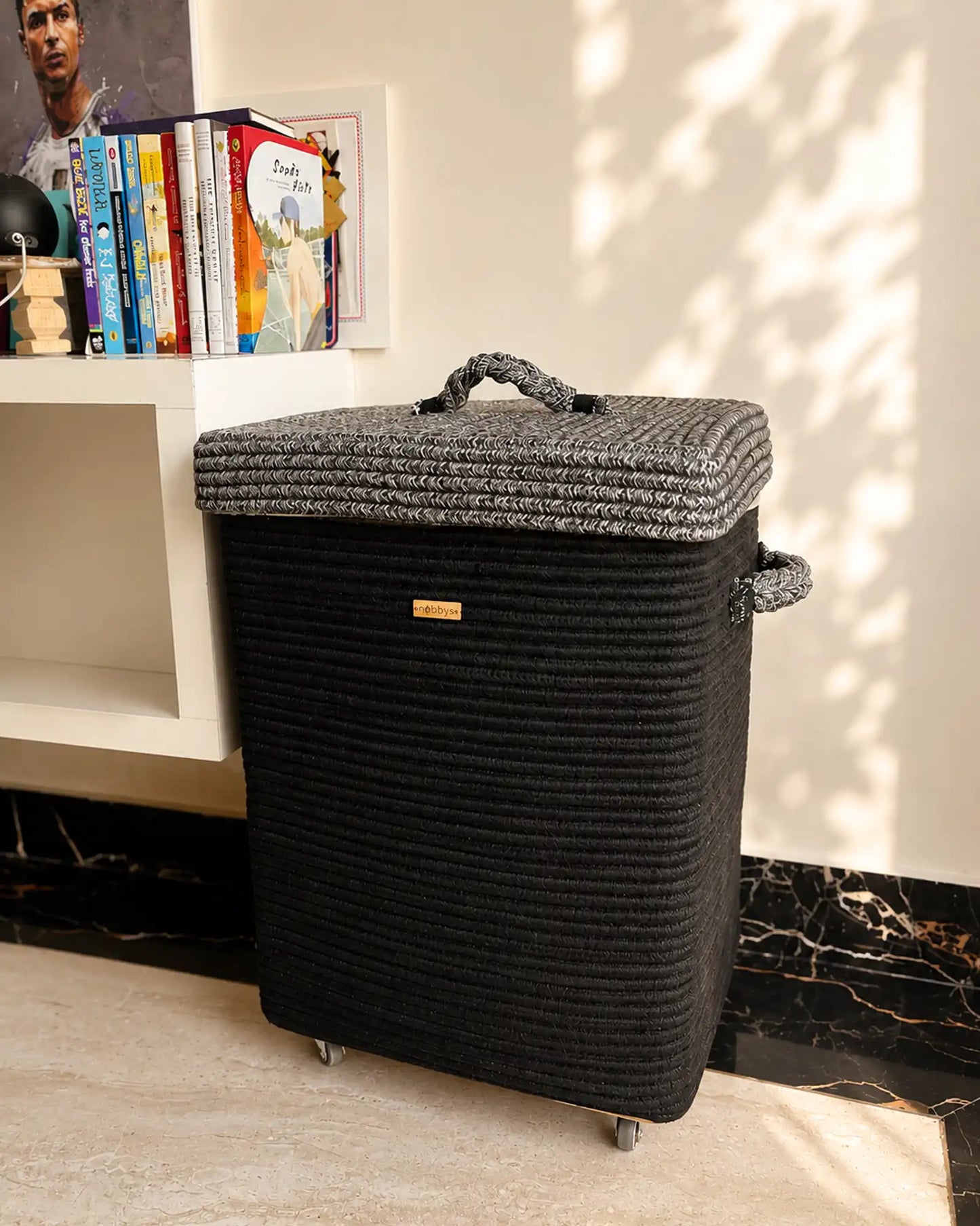 black laundry basket giving elegant look to the interiors