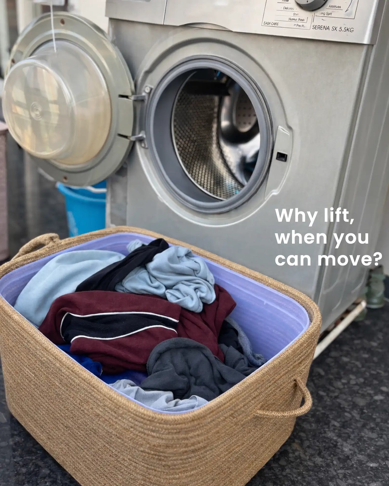 Laundry basket filled with clothes in front of an open washing machine