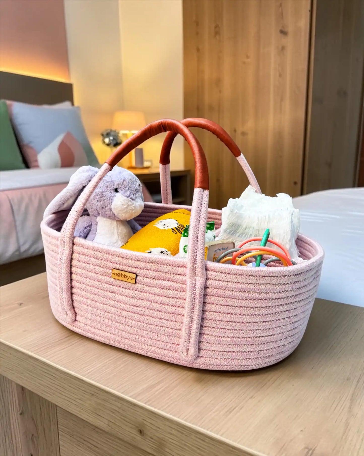 Baby pink diaper caddy with leather handles