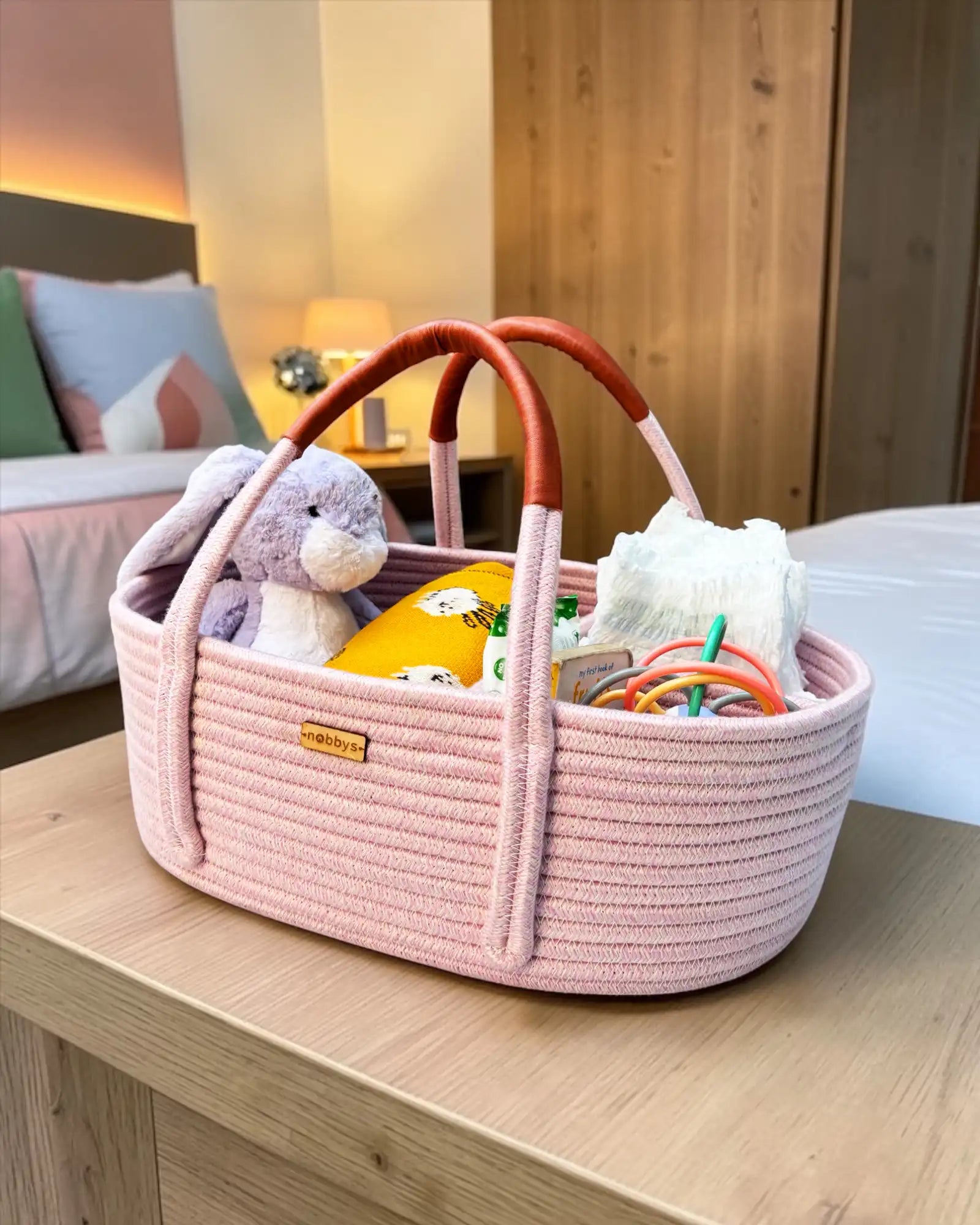 Baby pink diaper caddy with leather handles