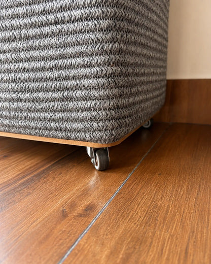 Grey Laundry Basket with wheels at the bottom to easily carry the clothes