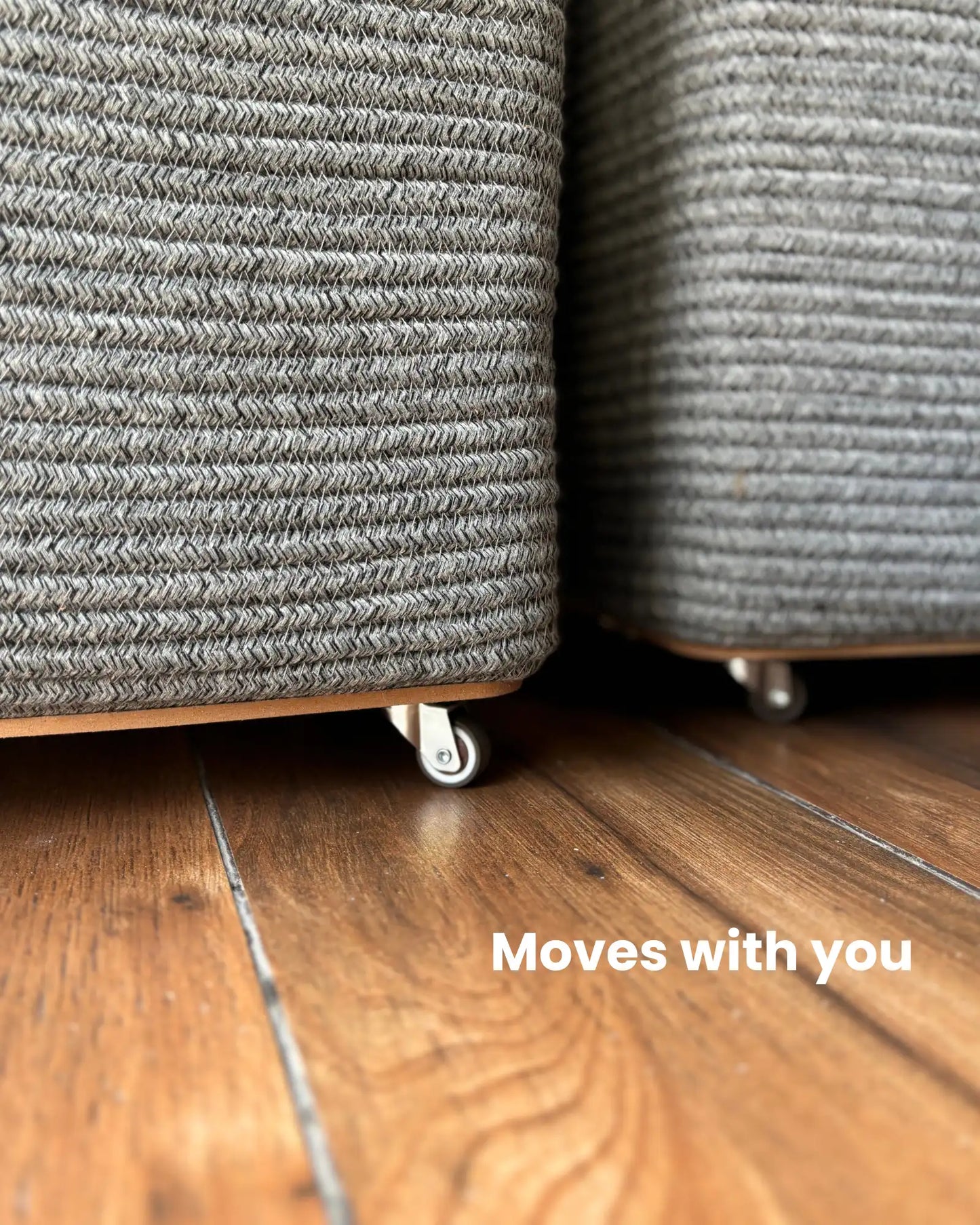 Grey Laundry Basket with wheels at the bottom to easily carry the clothes