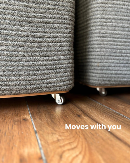 Grey Laundry Basket with wheels at the bottom to easily carry the clothes