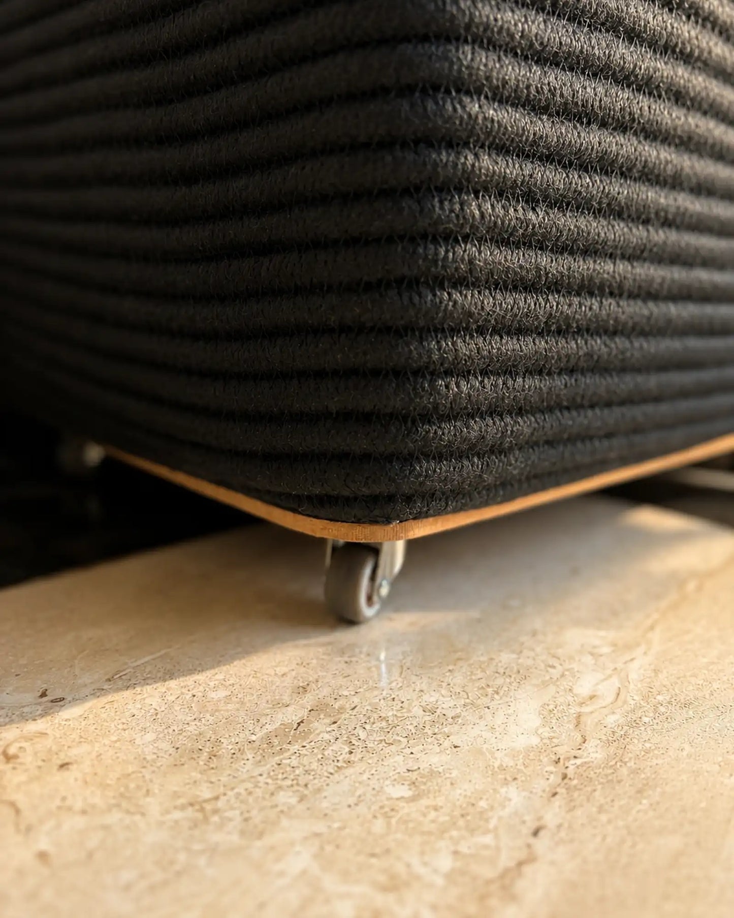 wheels on the black laundry basket