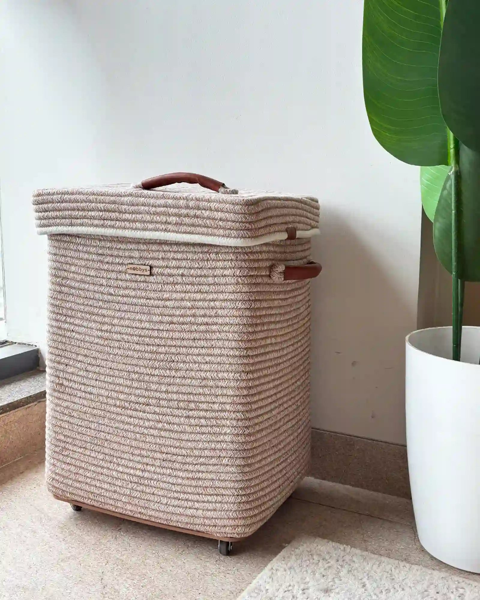 off white rectangular laundry basket with wheels