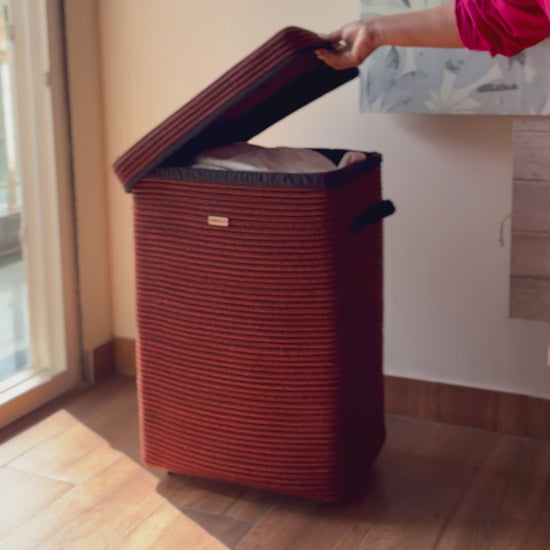 Designer laundry basket with lid, wheels, and side handles for easy transport